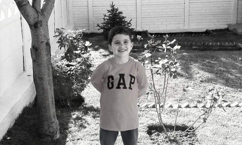 Yaz as a kid in a GAP sweatshirt